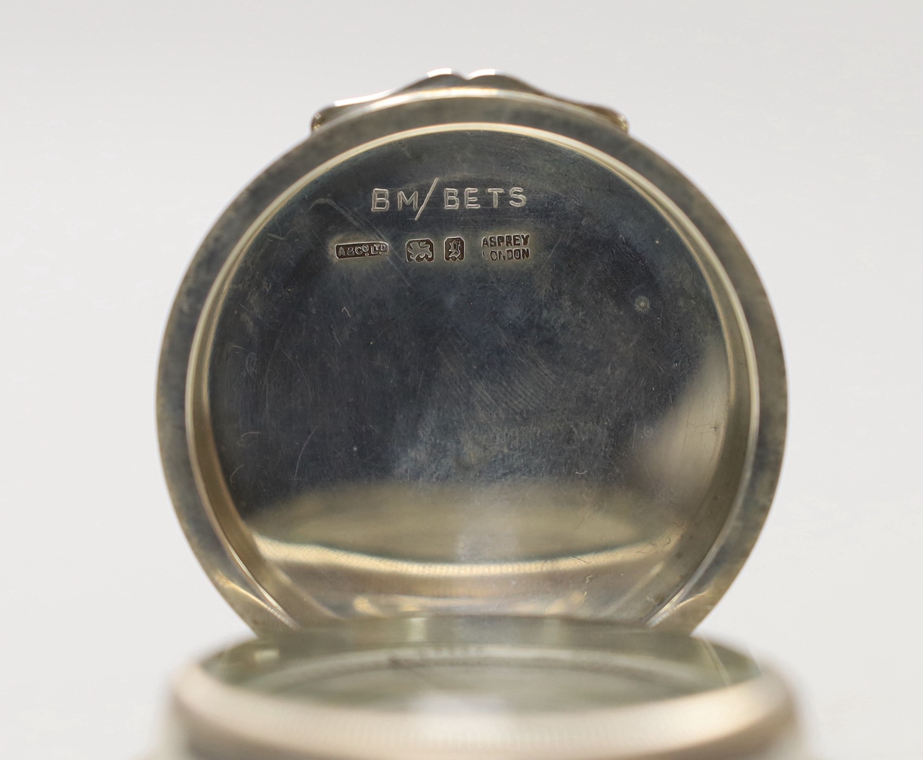 A George V Asprey & Co silver cased barometer, London, 1922, diameter 56mm.